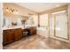 Luxurious bathroom with double vanity, soaking tub, separate shower, and ample natural light at 23318 N Las Positas Ct, Sun City West, AZ 85375