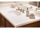 Elegant bathroom sink with brushed nickel fixtures, white countertop, and decorative accessories at 23318 N Las Positas Ct, Sun City West, AZ 85375