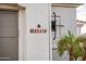 Exterior shot of home with address tile detail and desert landscaping at 23318 N Las Positas Ct, Sun City West, AZ 85375