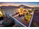 Inviting courtyard with comfortable seating surrounded by lush landscaping and tasteful outdoor lighting at 23318 N Las Positas Ct, Sun City West, AZ 85375