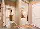 Hallway view to bedroom on left and living room on right at 23318 N Las Positas Ct, Sun City West, AZ 85375