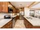 Spacious kitchen featuring stainless steel appliances, granite countertops, and ample cabinet space at 23318 N Las Positas Ct, Sun City West, AZ 85375