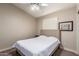 Carpeted bedroom with neutral paint, ceiling fan, and window with plantation shutters at 23402 N 22Nd Way, Phoenix, AZ 85024