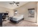 Bedroom with carpet, neutral paint, ceiling fan, and windows with blinds at 23402 N 22Nd Way, Phoenix, AZ 85024