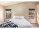 Bedroom with carpet, neutral paint, and windows with woven shades at 23402 N 22Nd Way, Phoenix, AZ 85024