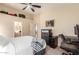 Bedroom with carpet, ceiling fan, neutral paint, desk and adjacent bathroom at 23402 N 22Nd Way, Phoenix, AZ 85024