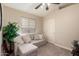 Carpeted bedroom with neutral paint, ceiling fan, and pull-out sofa at 23402 N 22Nd Way, Phoenix, AZ 85024