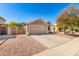 Single story home with a two-car garage and low maintenance gravel landscaping at 23402 N 22Nd Way, Phoenix, AZ 85024