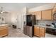 Kitchen with stainless steel refrigerator, granite countertops, and adjacent dining nook at 23402 N 22Nd Way, Phoenix, AZ 85024