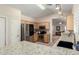 Well-lit kitchen featuring granite counters, stainless steel appliances, light wood cabinets, and breakfast bar at 23402 N 22Nd Way, Phoenix, AZ 85024