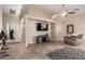 Spacious living room featuring neutral paint, tile floors, and a ceiling fan at 23402 N 22Nd Way, Phoenix, AZ 85024