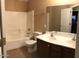 Bathroom featuring a shower, toilet, vanity and a large mirror at 25646 W Elwood St, Buckeye, AZ 85326