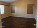 Large bedroom with three windows and hardwood floors at 25646 W Elwood St, Buckeye, AZ 85326