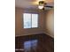 Bedroom featuring a window, ceiling fan and hardwood floors at 25646 W Elwood St, Buckeye, AZ 85326