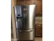 Close up of a stainless steel, energy-efficient refrigerator in a modern kitchen setting at 25646 W Elwood St, Buckeye, AZ 85326