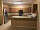 Spacious kitchen with stainless steel appliances, granite countertops, and ample cabinet space at 25646 W Elwood St, Buckeye, AZ 85326