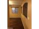 Living room featuring a window and hardwood floors at 25646 W Elwood St, Buckeye, AZ 85326