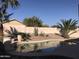 Beautiful backyard pool surrounded by lush landscaping, perfect for relaxation and entertainment at 25646 W Elwood St, Buckeye, AZ 85326