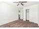 Bedroom includes neutral carpet, ceiling fan, and a closet with sliding doors at 25792 W Burgess Ln, Buckeye, AZ 85326