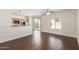 Bright living room featuring hardwood floors, recessed lighting, and connecting kitchen at 25792 W Burgess Ln, Buckeye, AZ 85326