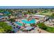 Aerial view of a community pool, spa, and a clubhouse with lush landscaping at 25822 S Eastlake Dr, Sun Lakes, AZ 85248