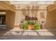 Photo displays the entrance to Cottonwood Bar & Grill, accented by decorative planters and a shaded pergola at 25822 S Eastlake Dr, Sun Lakes, AZ 85248