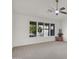 Bright bedroom featuring a ceiling fan, and multiple windows overlooking the yard at 25822 S Eastlake Dr, Sun Lakes, AZ 85248