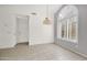 Dining area featuring a large arched window and tile floors at 25822 S Eastlake Dr, Sun Lakes, AZ 85248