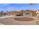 Charming single-story home showcasing desert landscaping and a Spanish tile roof at 25822 S Eastlake Dr, Sun Lakes, AZ 85248