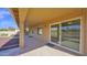 Covered patio area with sliding glass doors and views of the backyard at 25822 S Eastlake Dr, Sun Lakes, AZ 85248