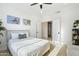 Well-lit bedroom with neutral palette, comfortable bed, and view to the outdoor landscape at 27641 N 74Th St, Scottsdale, AZ 85266