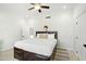 Bedroom featuring a comfortable bed, ceiling fan, and light colored tile flooring at 27641 N 74Th St, Scottsdale, AZ 85266