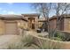 Charming single-story home with tile roof, desert landscaping, and stone accents in a serene setting at 27641 N 74Th St, Scottsdale, AZ 85266