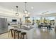 Modern kitchen featuring a granite island, stainless steel appliances, and an adjacent dining area at 27641 N 74Th St, Scottsdale, AZ 85266