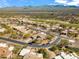 Beautiful aerial view of a well-maintained property near a golf course and with mountain views in the background at 27913 N Walnut Creek Rd, Rio Verde, AZ 85263