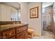 Bathroom featuring granite counters, raised panel cabinets and tiled shower at 27913 N Walnut Creek Rd, Rio Verde, AZ 85263