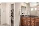 Bathroom featuring warm wood cabinets, neutral walls and well lit vanity at 27913 N Walnut Creek Rd, Rio Verde, AZ 85263