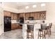 Spacious kitchen featuring wooden cabinets, granite countertops, and breakfast bar at 27913 N Walnut Creek Rd, Rio Verde, AZ 85263