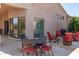 Relaxing outdoor patio featuring stone flooring, an outdoor dining set and a fire pit seating arrangement at 27913 N Walnut Creek Rd, Rio Verde, AZ 85263