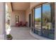 Inviting covered patio with comfortable seating and views of the desert landscape at 27913 N Walnut Creek Rd, Rio Verde, AZ 85263