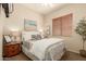 Cozy bedroom features a comfortable bed, natural light, and tasteful decor at 2909 N 111Th Dr, Avondale, AZ 85392