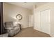 Relaxing living room featuring a comfortable recliner and view of the closet at 2909 N 111Th Dr, Avondale, AZ 85392