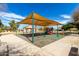 Community playground with vibrant play structures and shade canopy, designed for Gathering fun and recreation at 2909 N 111Th Dr, Avondale, AZ 85392