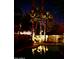 Night view of the pool featuring the lighting and surrounding landscaping at 2909 N 111Th Dr, Avondale, AZ 85392