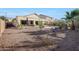 Expansive backyard showcasing desert landscaping and patio at 29681 W Amelia Ave, Buckeye, AZ 85396