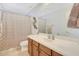 Well-lit bathroom with a white sink vanity, shower, and neutral color scheme at 29681 W Amelia Ave, Buckeye, AZ 85396