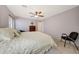 Comfortable bedroom with a ceiling fan, carpet, and a dresser at 29681 W Amelia Ave, Buckeye, AZ 85396