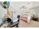 Bedroom with desk, ceiling fan, and warm decor at 29681 W Amelia Ave, Buckeye, AZ 85396