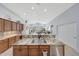 Expansive kitchen island with granite countertop and stainless-steel dishwasher, opening to living space at 29681 W Amelia Ave, Buckeye, AZ 85396