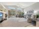 Bright living room with vaulted ceilings, fireplace, and sliding glass doors to the backyard at 29681 W Amelia Ave, Buckeye, AZ 85396